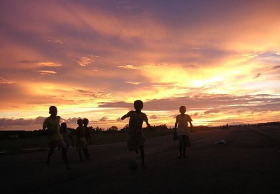 Children playing during sunset